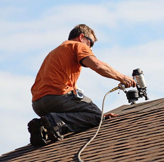 Jack on a roof with a nail gun